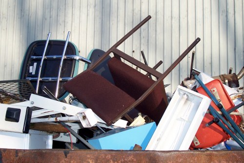 Office furniture being sorted for clearance and recycling