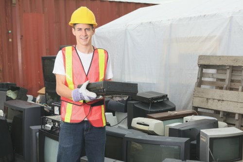 Professional team managing builders’ waste in Woolwich