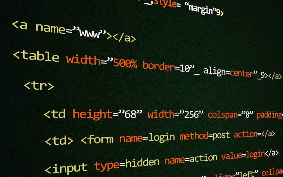 A close-up photograph of a computer screen displaying lines of colourful and blurred programming code. The text includes various keywords, functions, variables, and syntax elements in shades of red, g